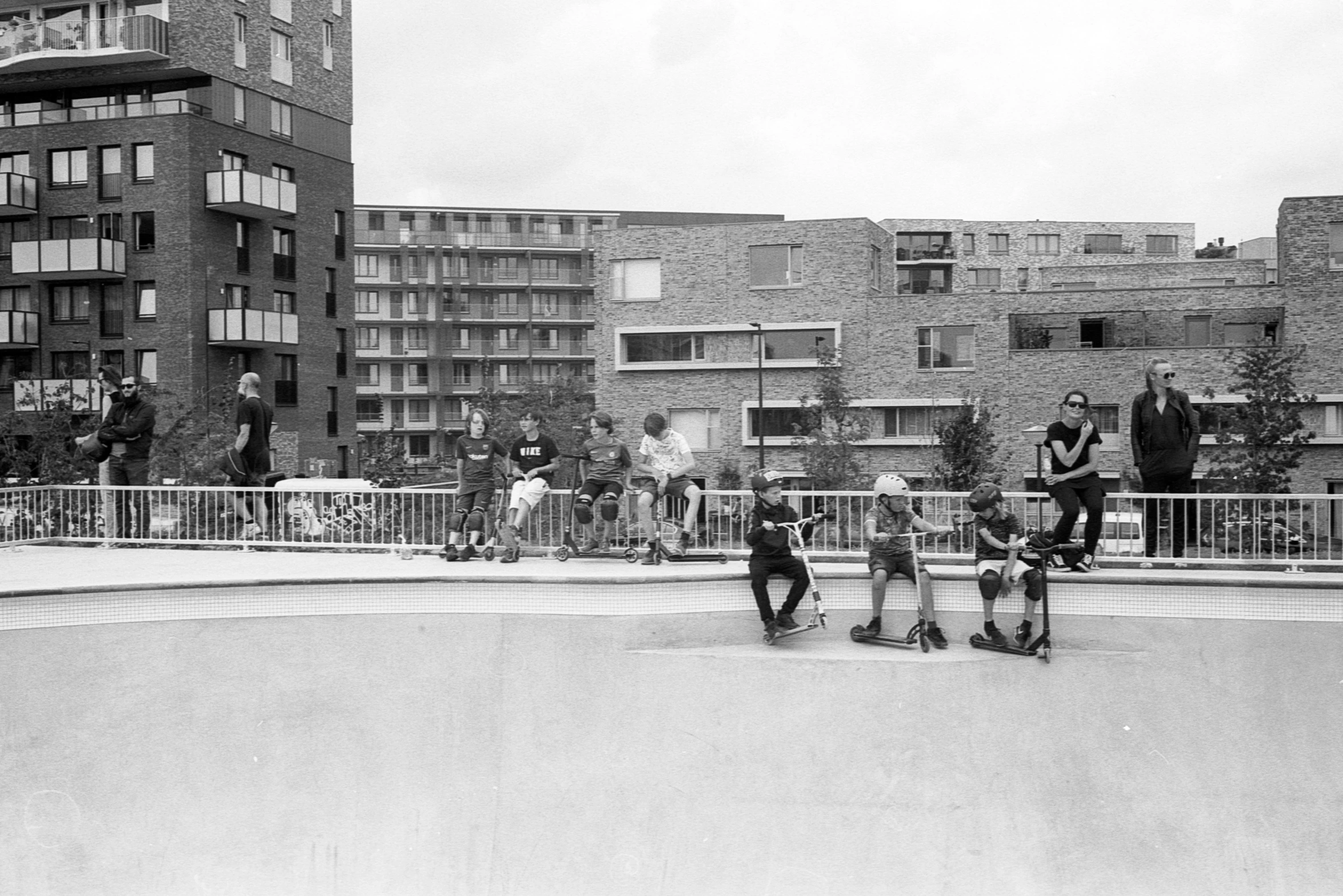 the group of people are playing in the pool