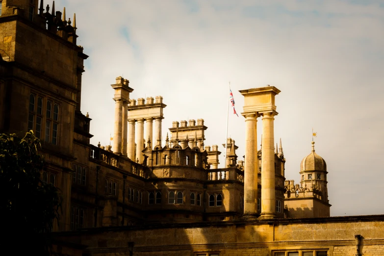 the building with pillars on the top has a flag