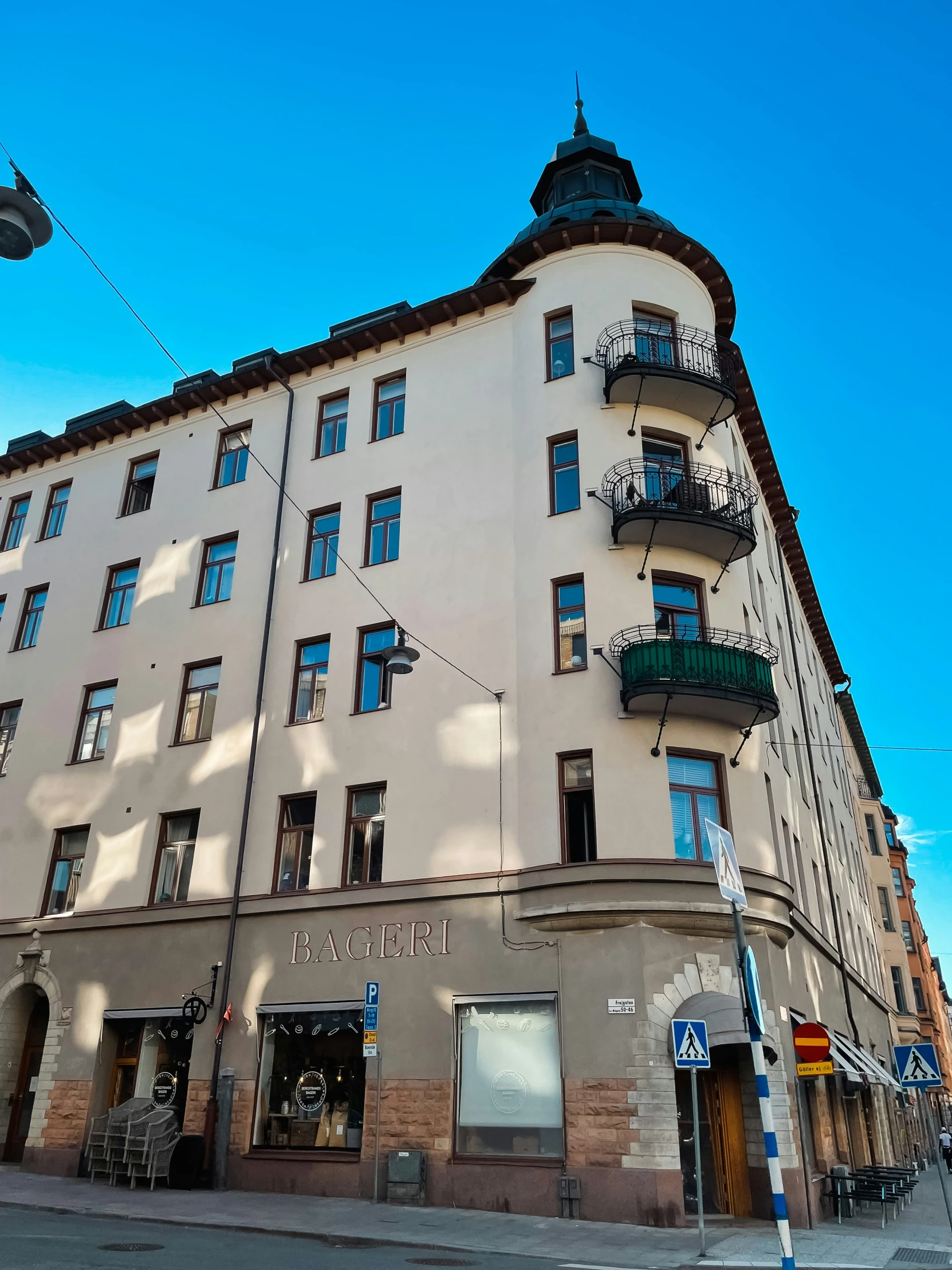 a very tall and white building with many windows