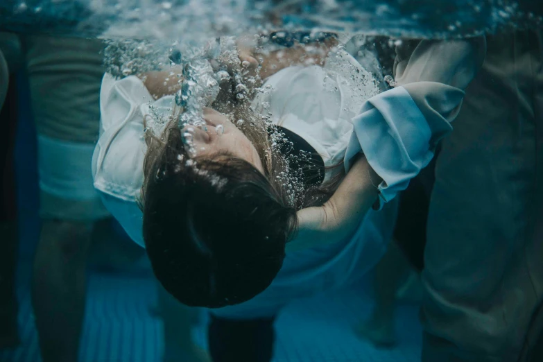 the  swimming underneath water in a suit