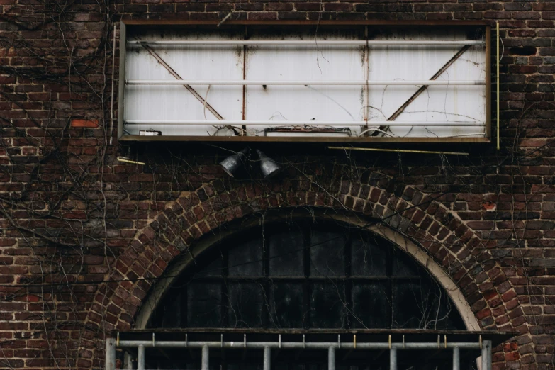 a window frame on top of a brick building