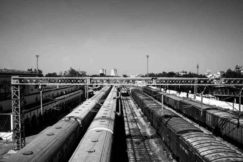 a view of train yard with many trains on it