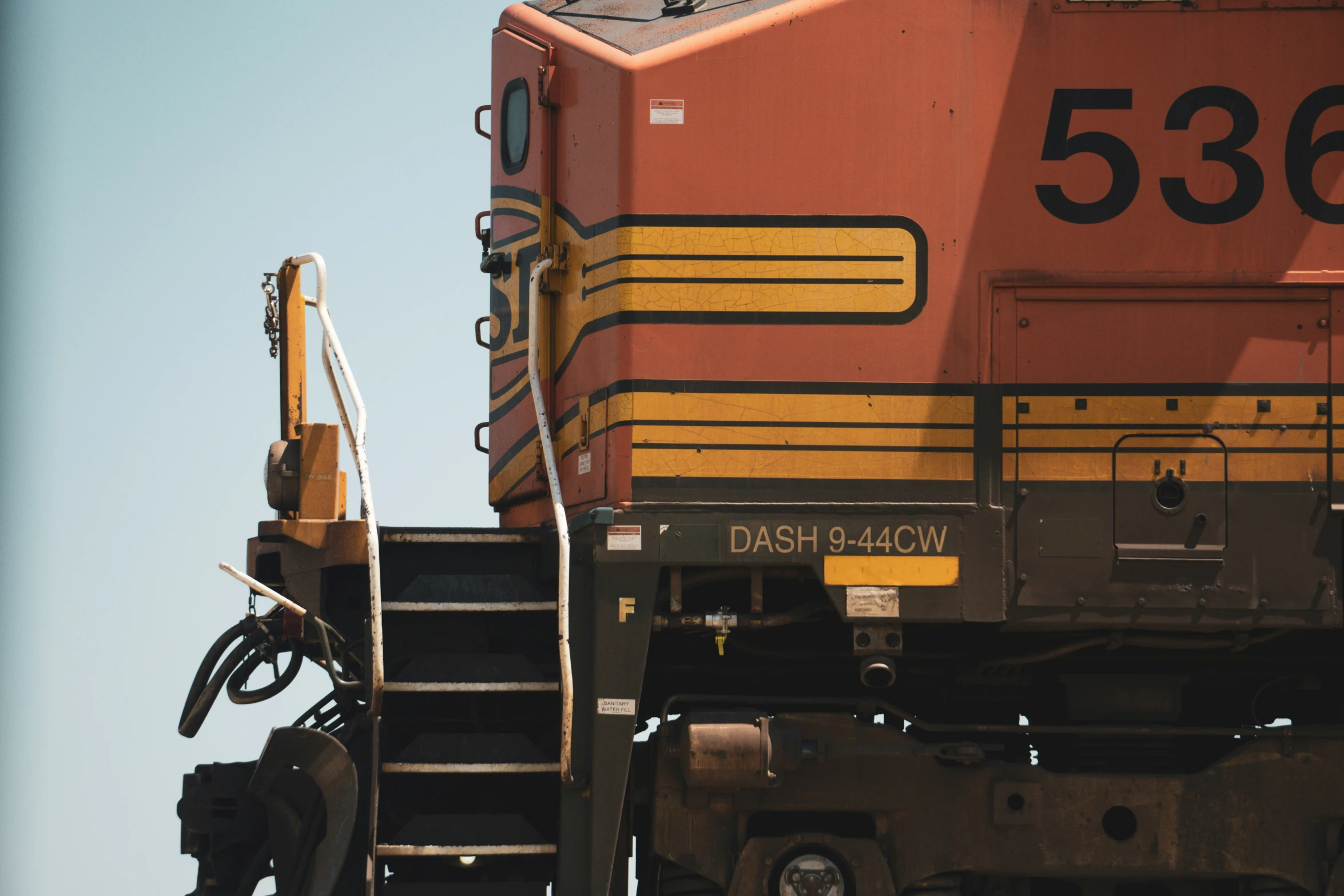 a cargo train has its stairs up to the top