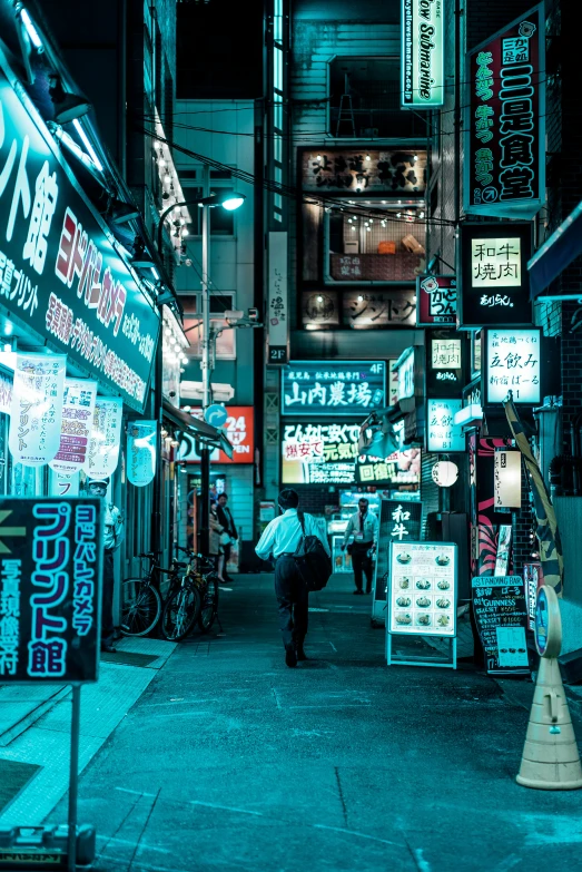 a person with an umbrella in front of shops