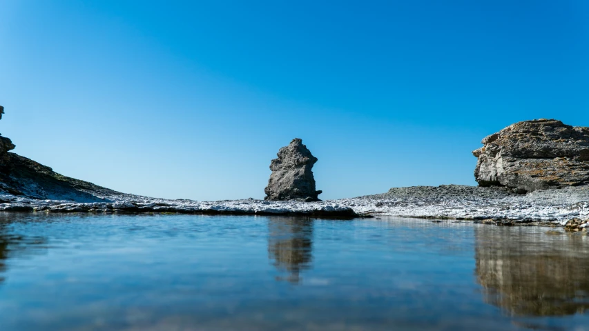 the beach has several rock formations on it