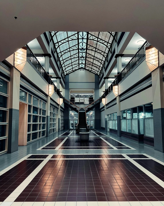 this is an empty shopping center with windows and a walkway