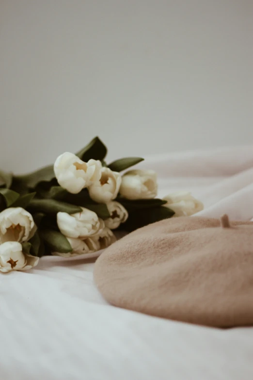 some flowers that are sitting on top of a bed