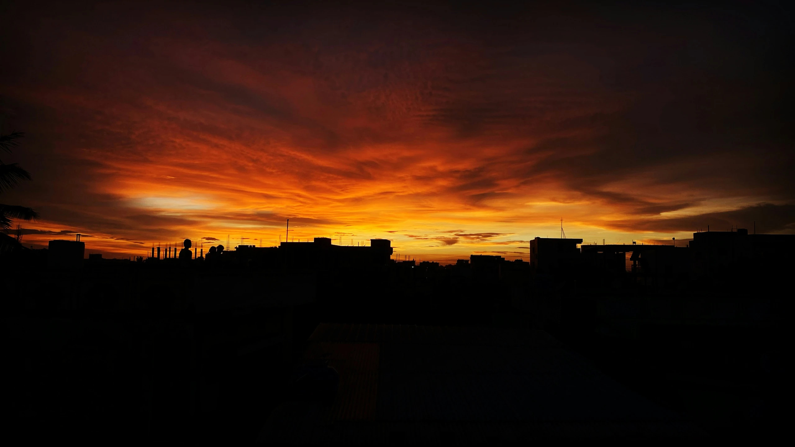 some red and yellow clouds in a dark sky