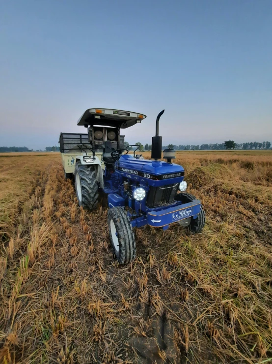 a tractor is sitting out in the middle of the field