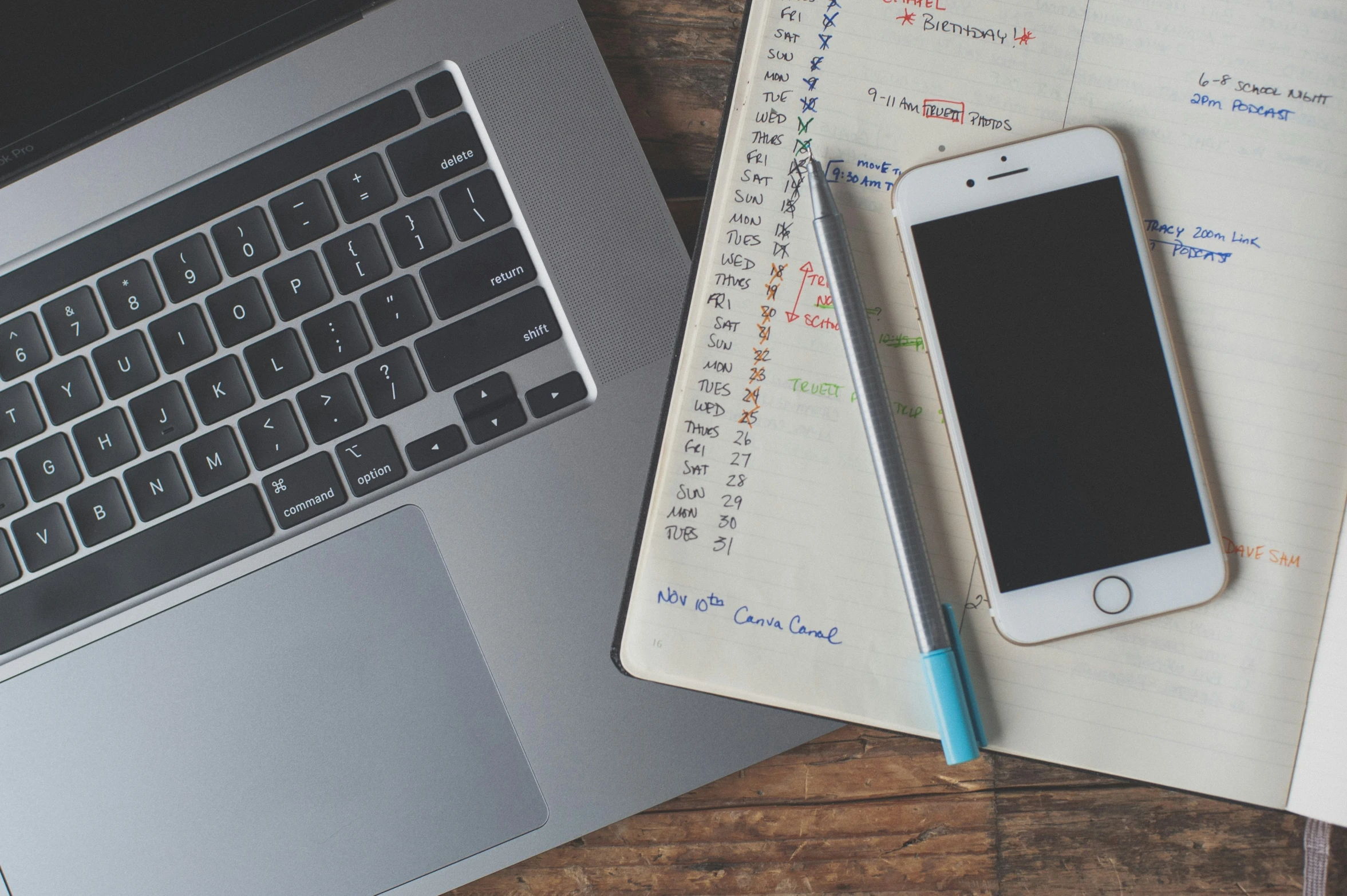 a notepad, pencil and smart phone sitting on top of a notebook