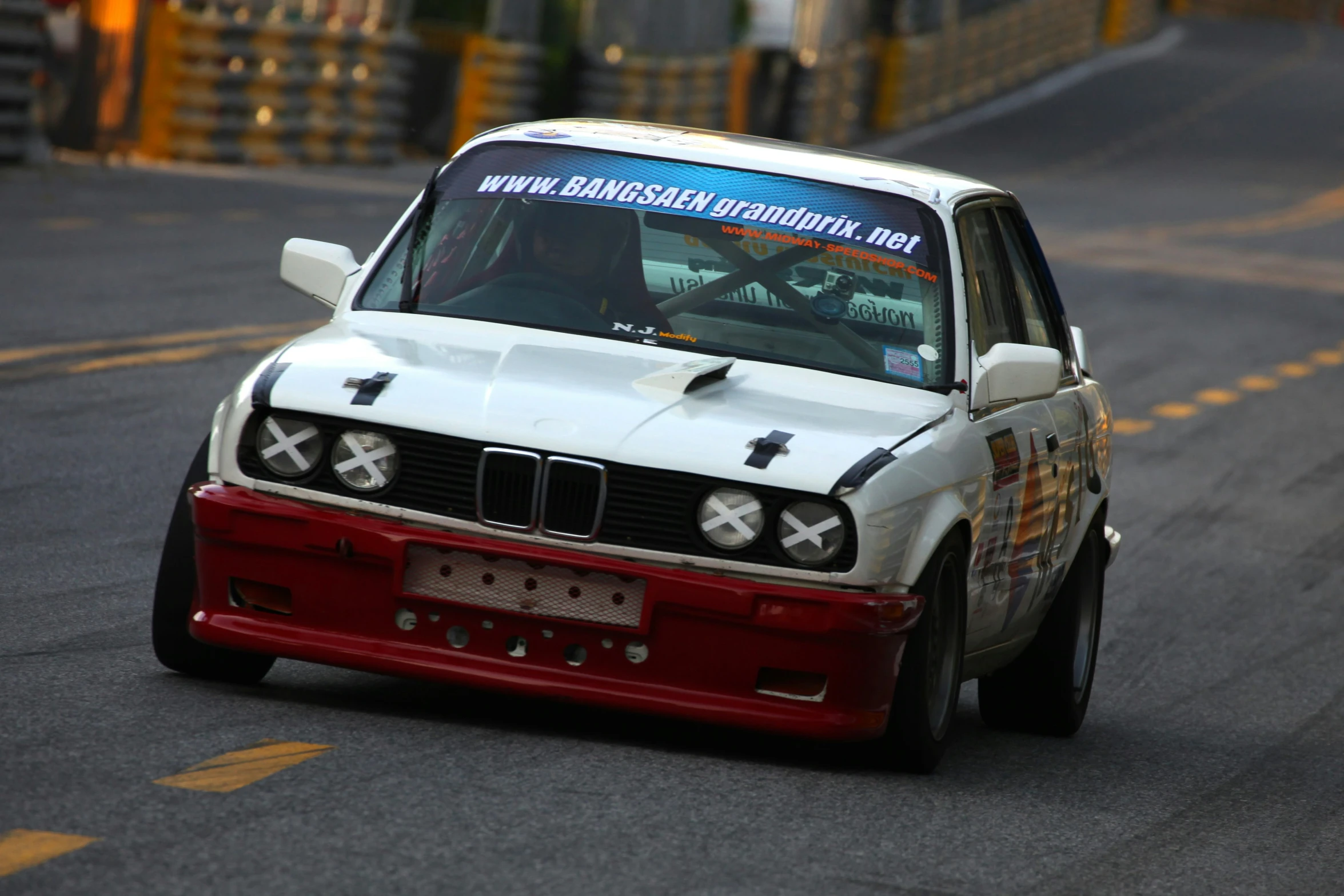 a modified car on a race track during daytime