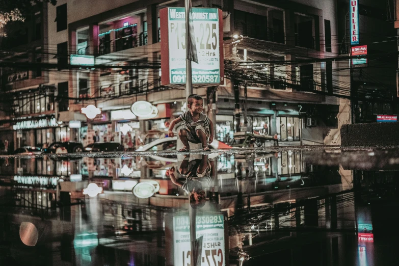 an image of the lights and reflection of buildings