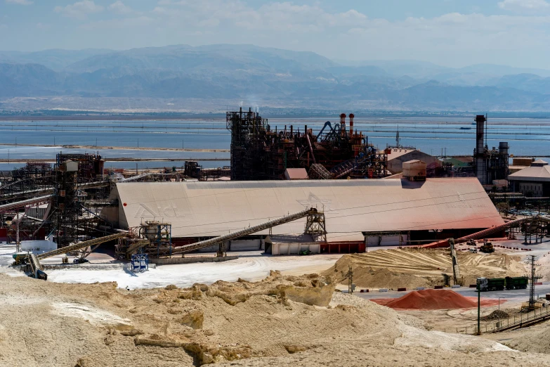 the factory site sits at the edge of a mountain range