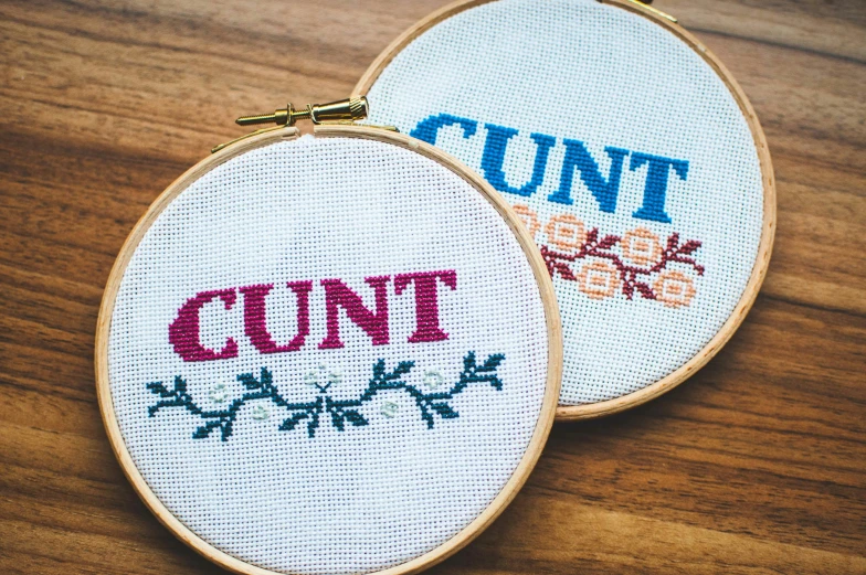 two cross stitch hoops, one saying count