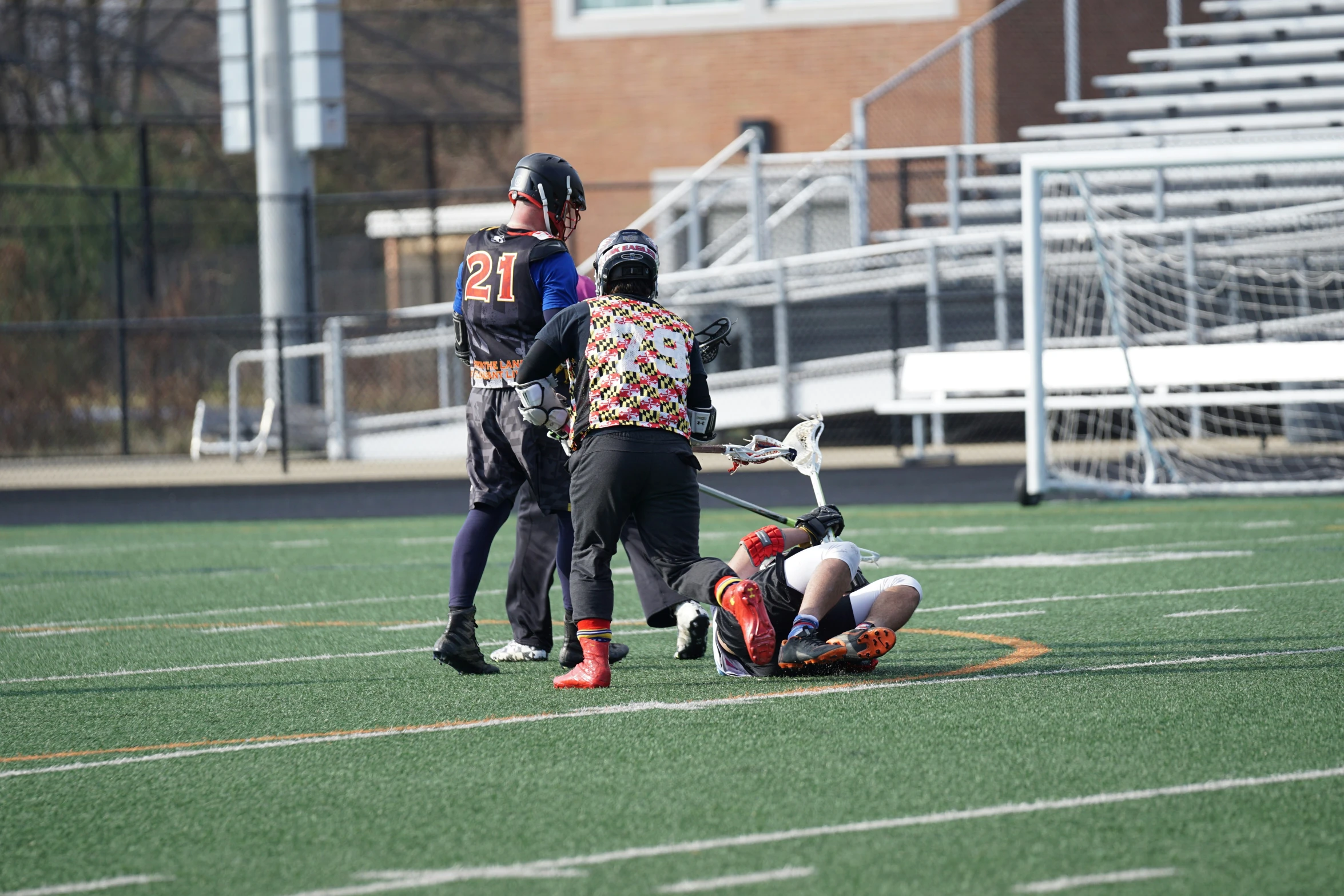 an umpire, catcher and football player on a field