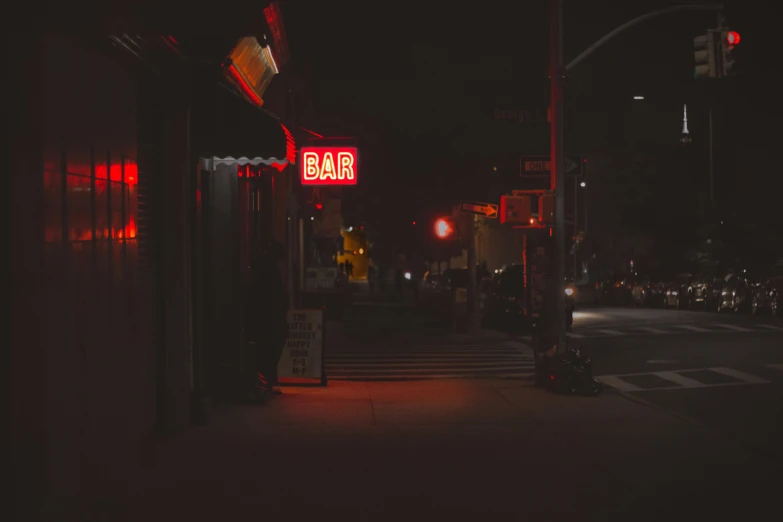 this is a night time view of a street at an intersection