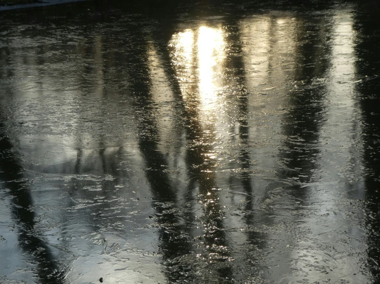 water reflects on the reflective surface of the street