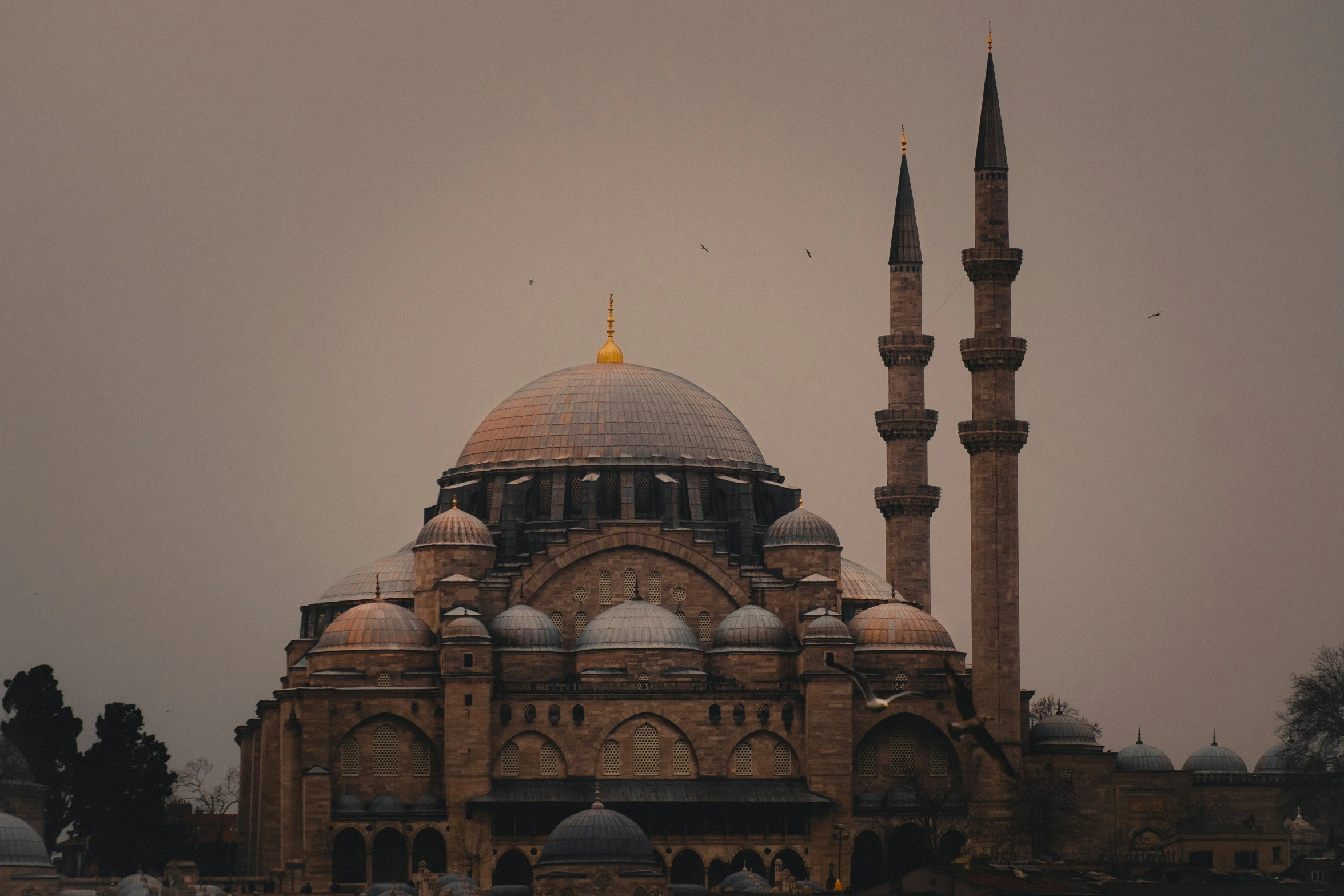 there is an ornate building that has two large towers and a circular roof