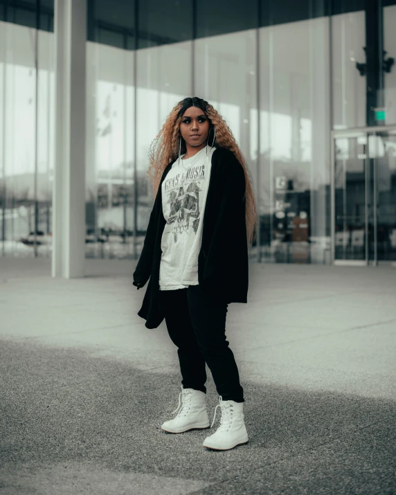 a young woman standing outside of a building