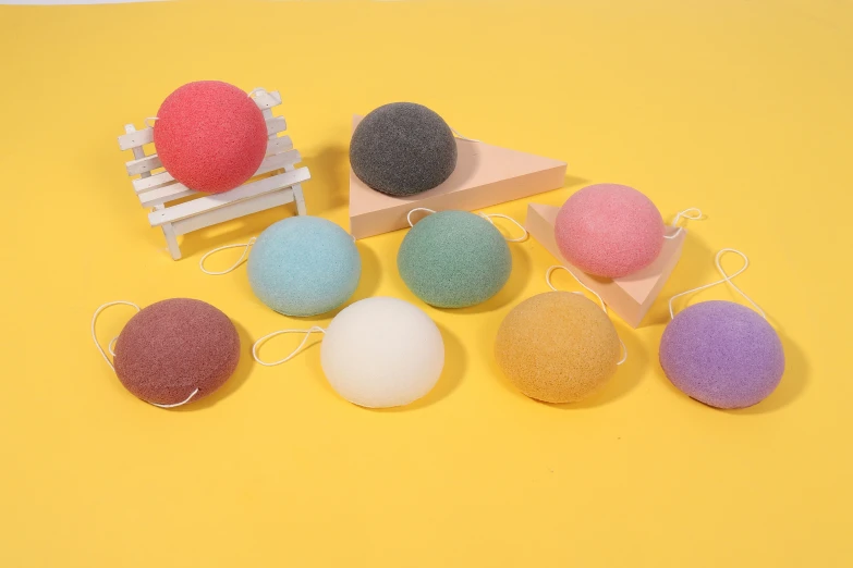 several balls of wool sit next to each other on a table