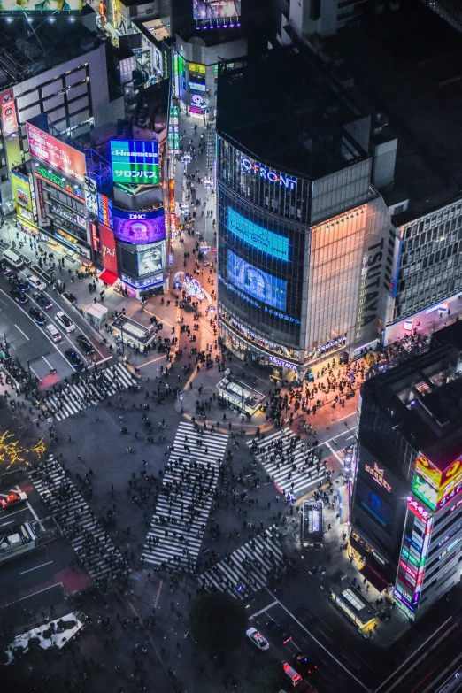 an aerial view of a street intersection in the city