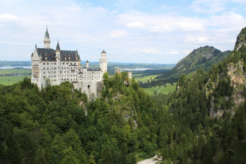 a beautiful castle sitting on top of a hillside