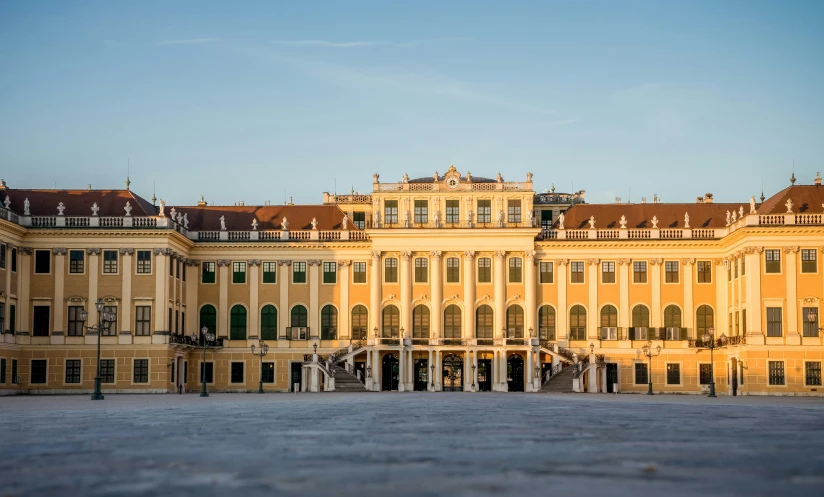 a large yellow building with many windows