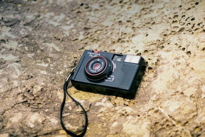 a picture of a camera lying on the ground