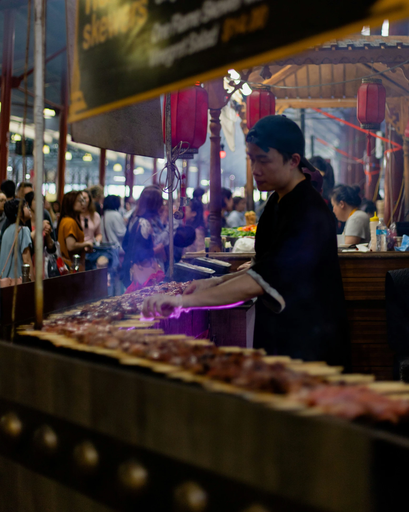 people waiting to order food at an asian restaurant