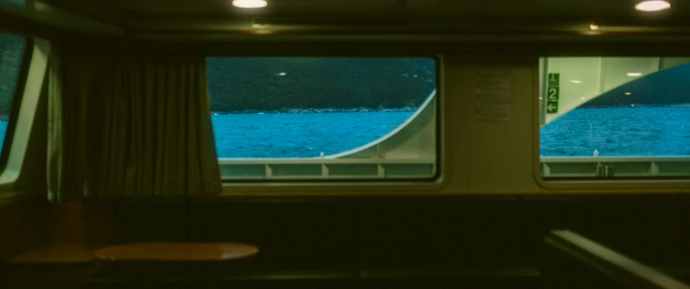 looking out a train window at a body of water