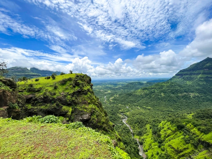 an outdoor view point of a valley and mountain