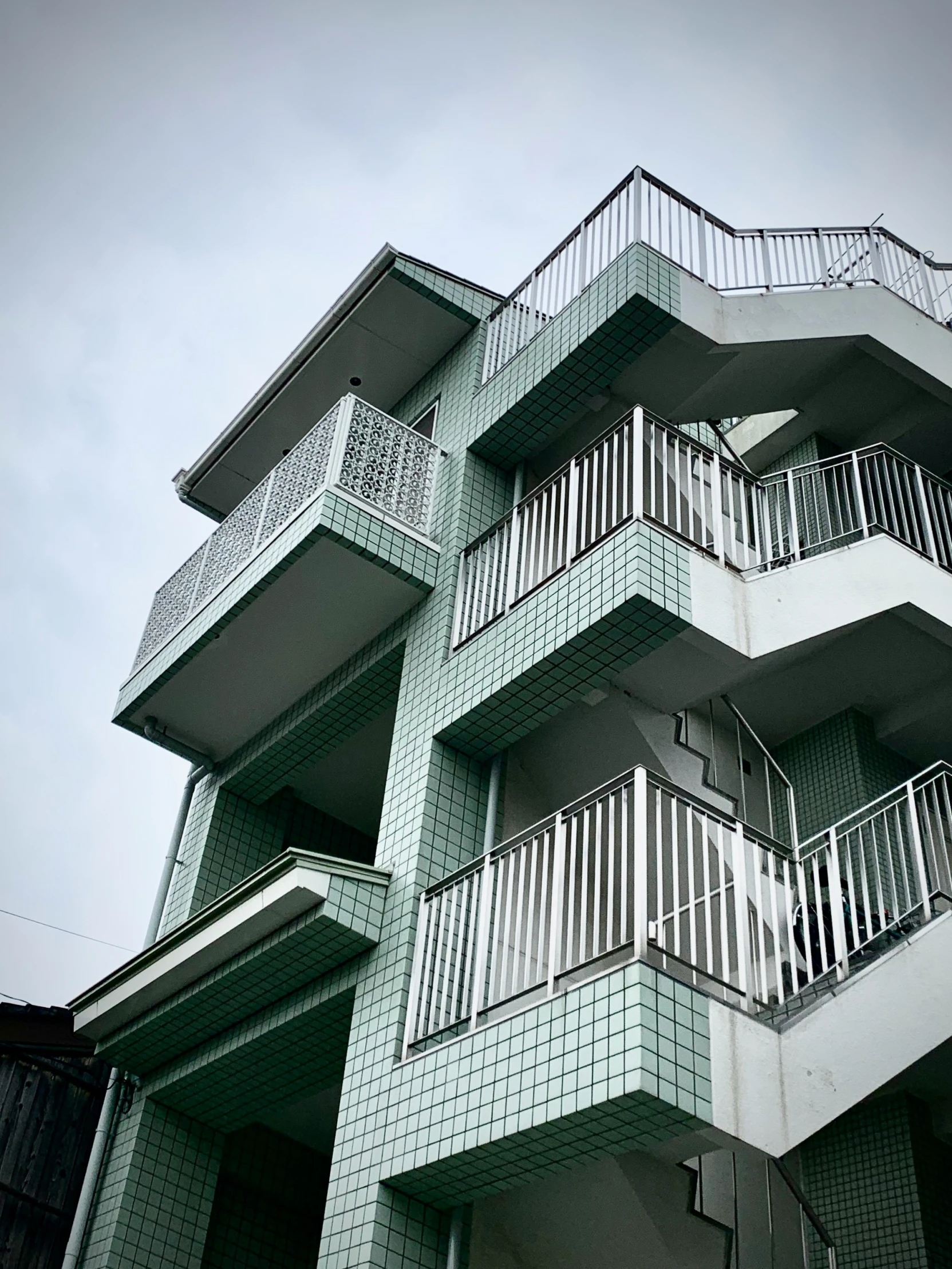 a building with many balconies sitting outside of it