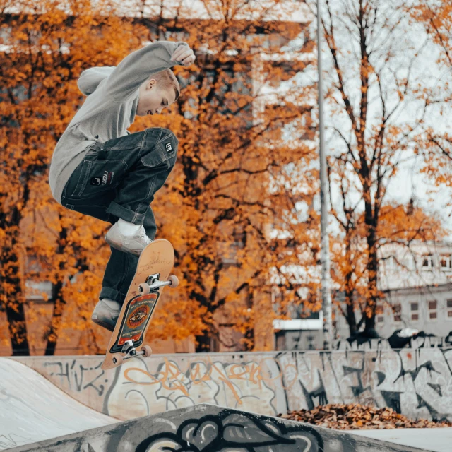 a skate boarder doing a trick on the half pipe