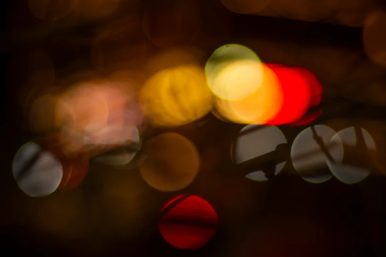 blurry image of a traffic light with several colors in the background
