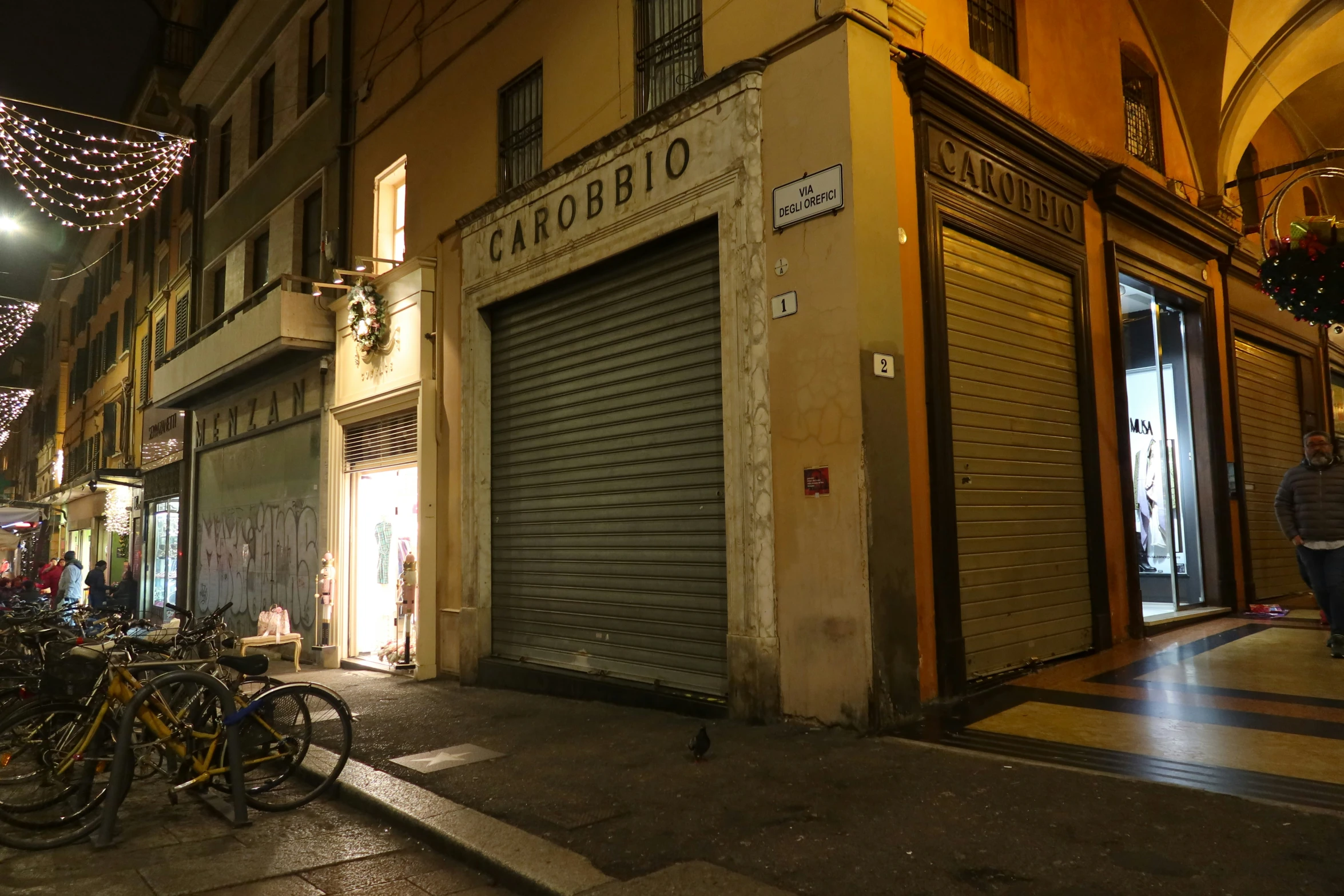 bicycles are parked outside a store on the street