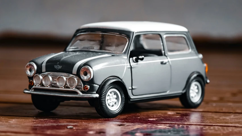 an old model car is painted gray