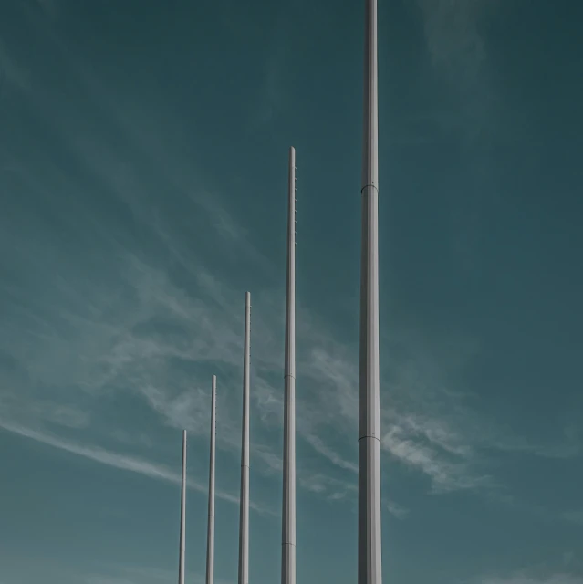 a number of poles with long poles sticking out from them