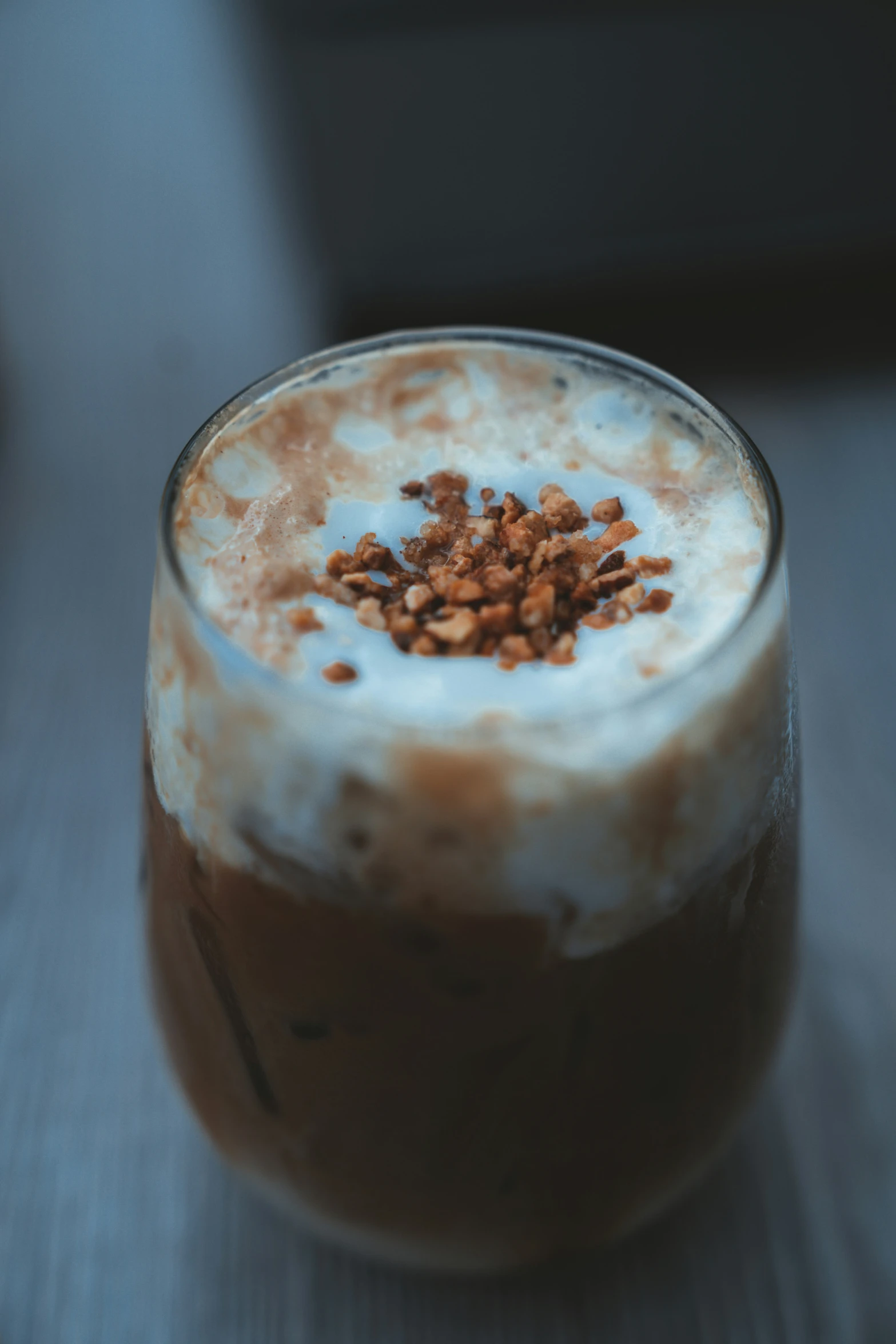 a milkshake with coffee and nuts on it