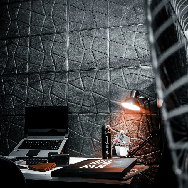 a desktop with a lamp and laptop computer on it