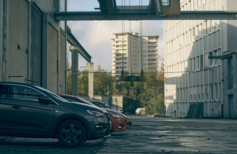 several cars parked along the side of a city street