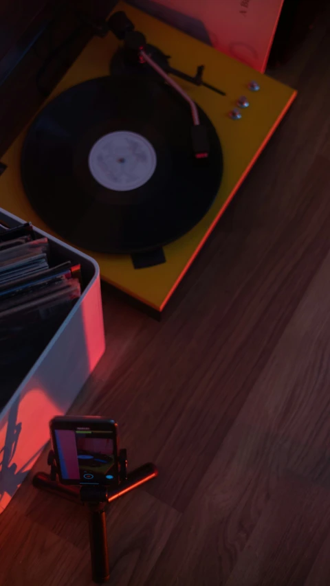 the record player is on a wooden table