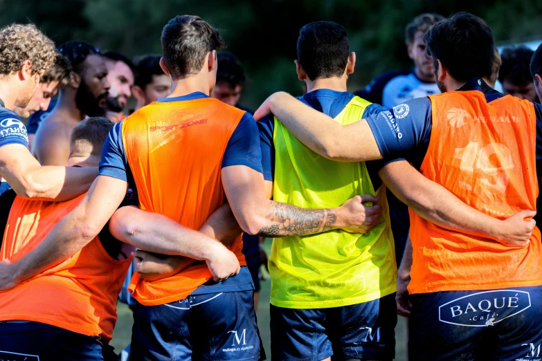 a group of men in uniform huddled together