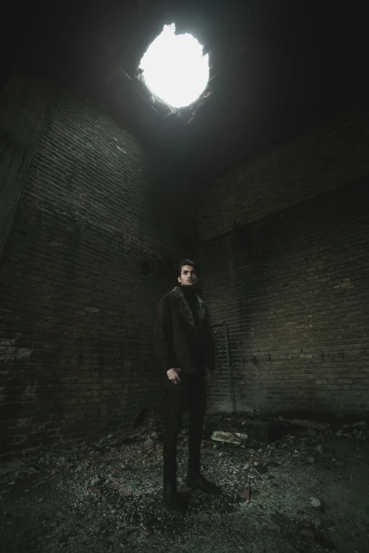 a man standing in an empty alley at night