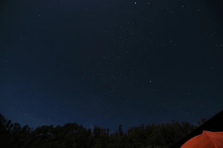 the night sky is glowing bright with stars