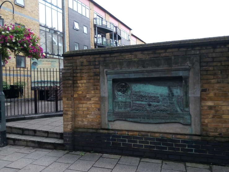 an old brick building with the plaque showing a city in china