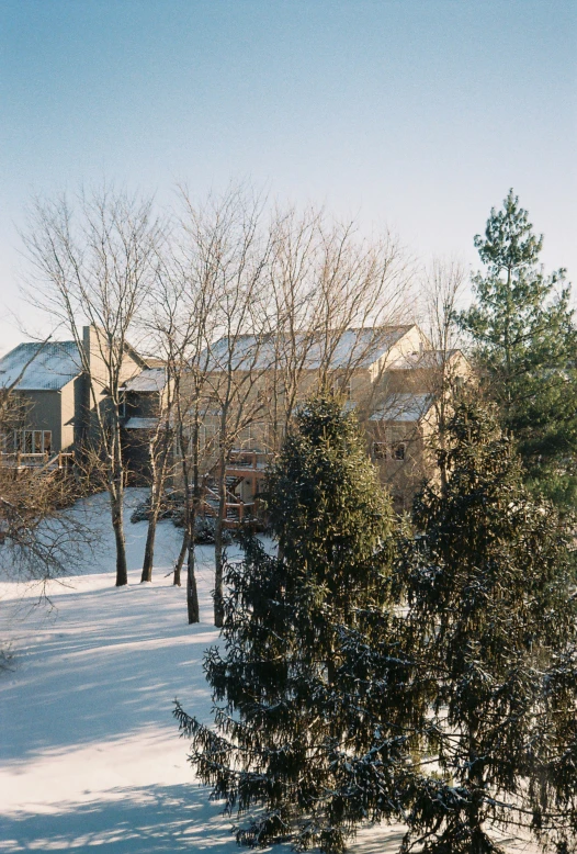 a building on a snowy hill in the daytime