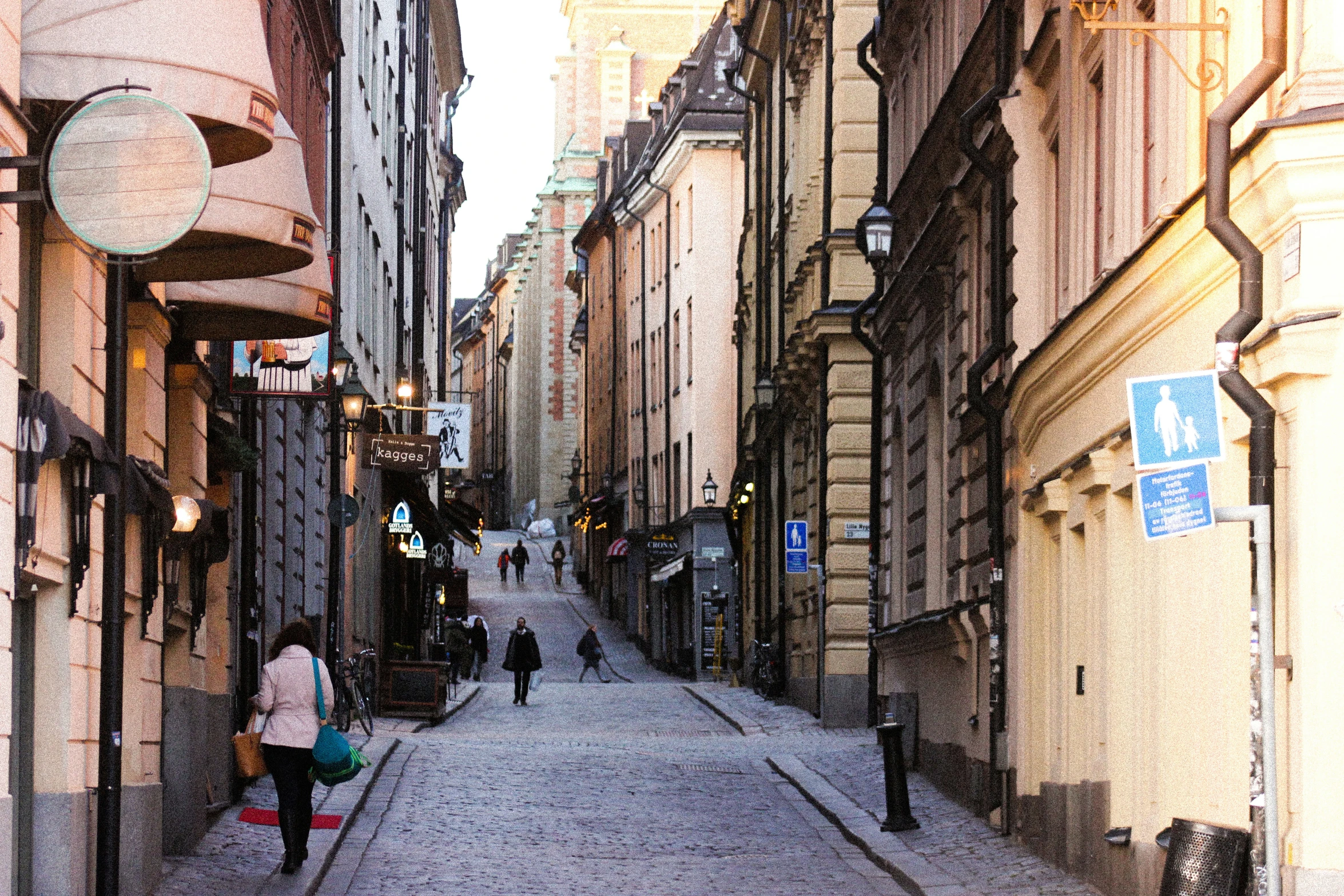 a person with bags is walking down the street