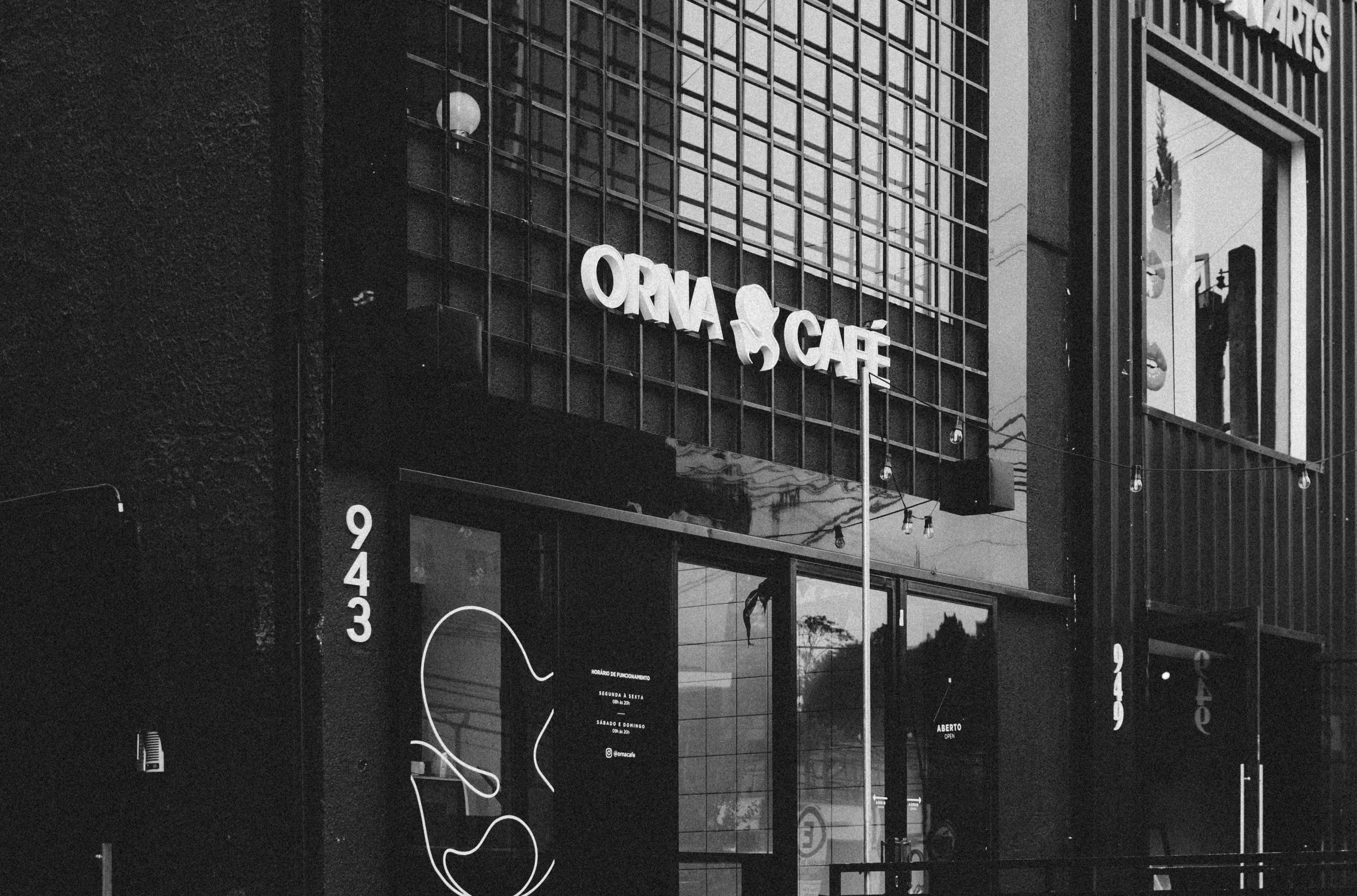 a store front is seen on a dark street