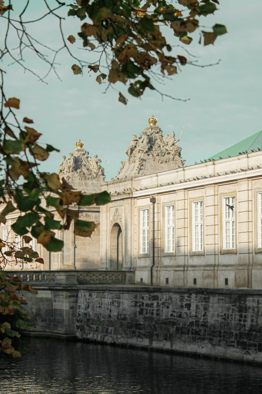 a large building sitting next to a body of water