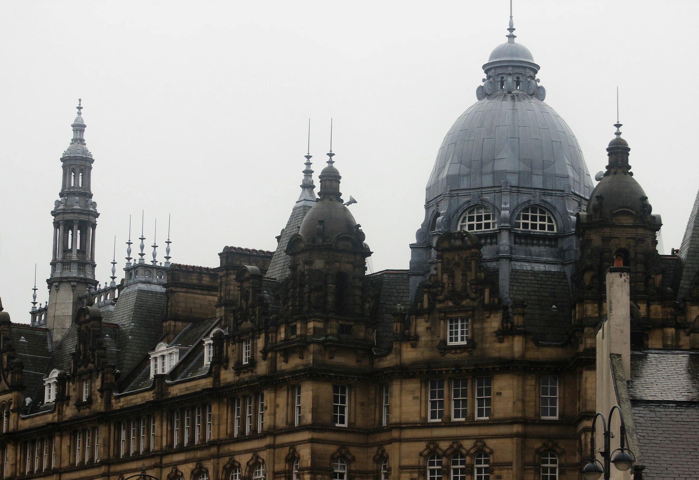 old buildings in a city, covered with heavy smog